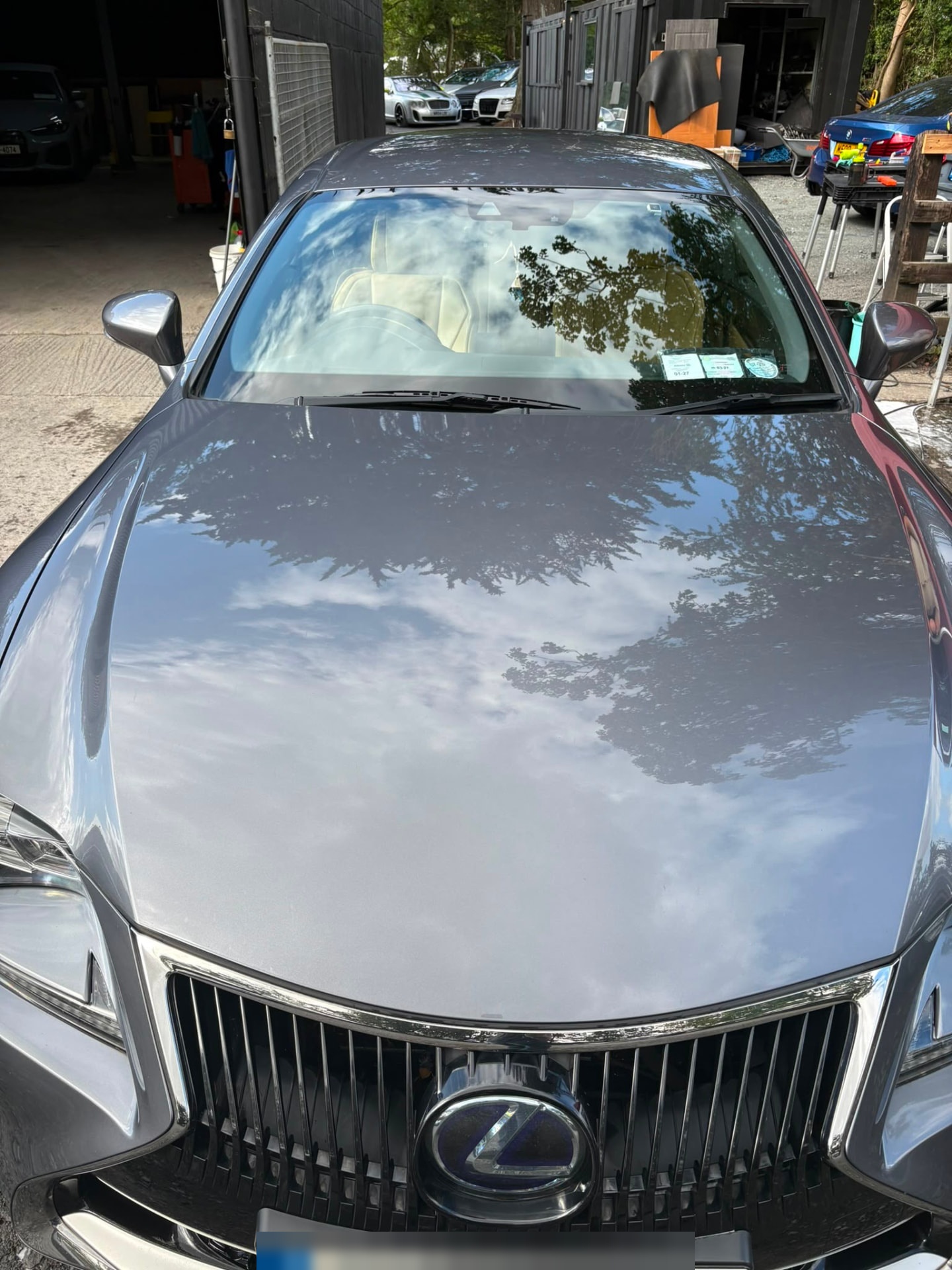 Grey Lexus bonnet with mirror reflections after a full valet
